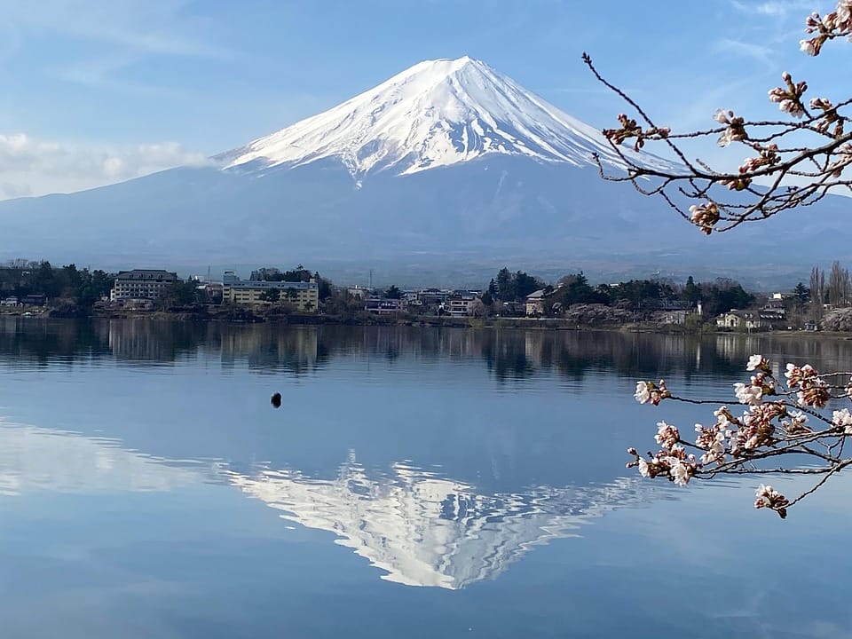 Fuji reflected in snow-dusted Lake Kawaguchiko