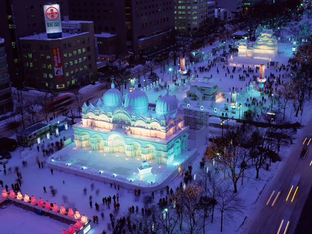 Night view of illuminated snow sculpture at Sapporo Snow Festival Odori Park