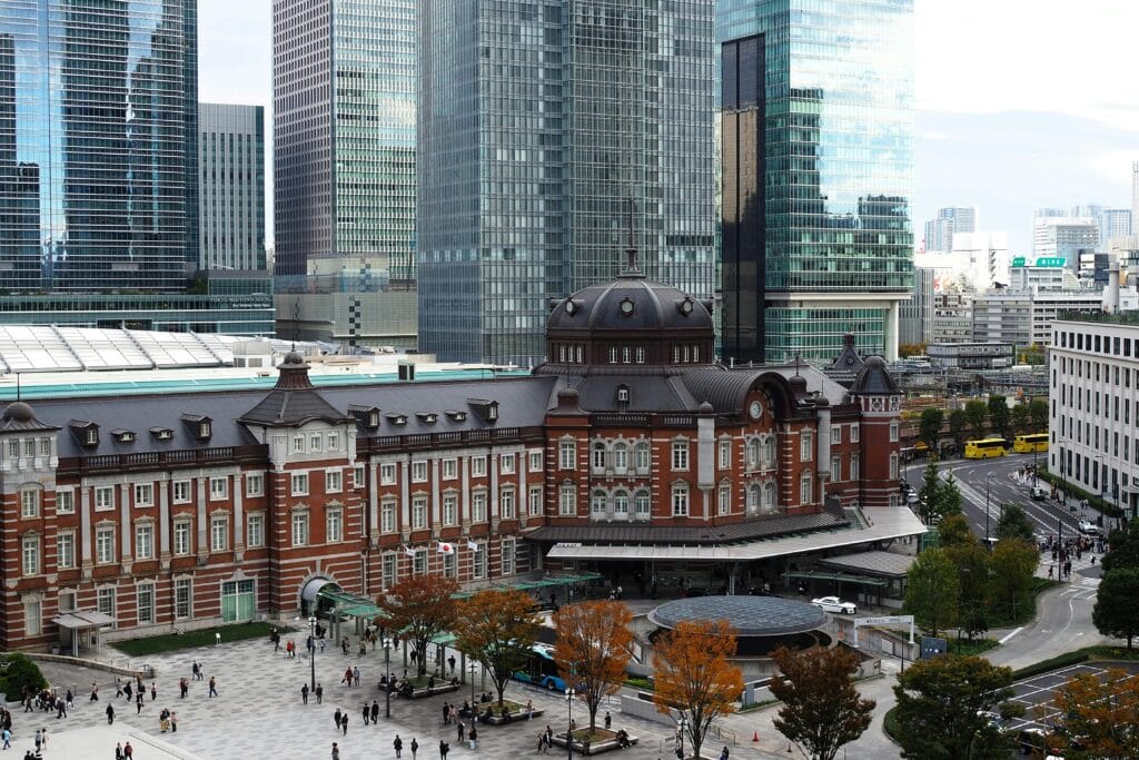 A stunning view of Tokyo Station with modern skyscrapers in Chiyoda City, Tokyo, Japan.