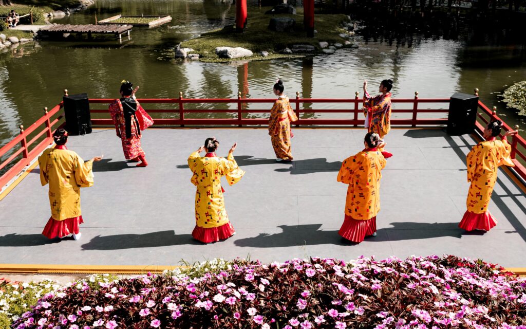 How to Get Around Okinawa: Transport, Car Rental & Ferry Guide Traditional Japanese dancers performing at Buenos Aires Japanese Garden.